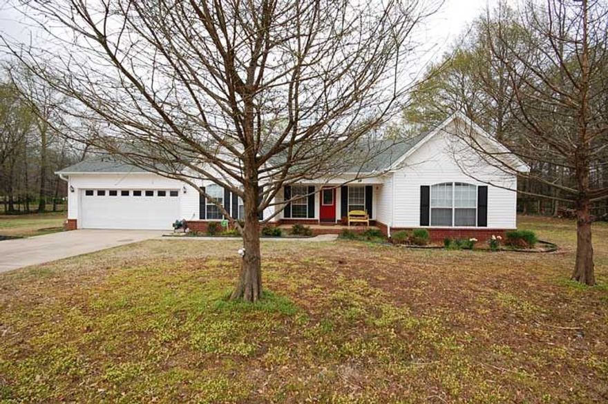 This darling house has so much to offer.  This home sits on 3.28 beautiful acres.  Interior has 3 bedrooms and an office/4thbed with a split bedroom floorplan. Living room has tray ceiling.  Kitchen/dining combo is spacious with island, breakfast bar, lots of cabintes and built in hall tree.  Good sized bedrooms, master is large with double sinks, jetted tub and shower.  Large corner lot with lots of space and extras, fishing pond with dock, storage building, barn and covered awning.  Take a look today!