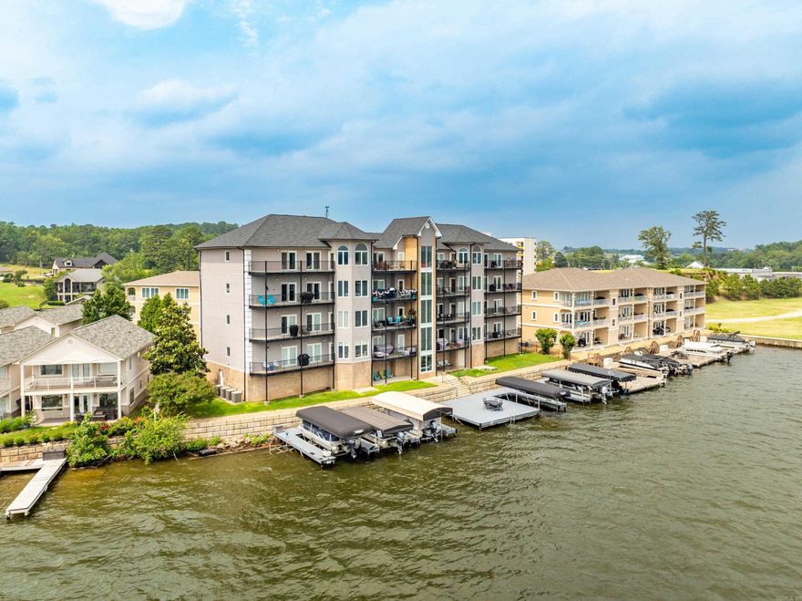 This AMAZING Bird’s Eye View Condo Overlooking Lake Hamilton is in the Most Perfect Location!The moment you walk thru the door you're greeted w/stunning panoramic lake viewsThis beautifully updated,fully furnished condo offers an open floor plan w/tile flooring,custom trim & thoughtful designer touches throughout.Enjoy a spacious kitchen w/a large breakfast island,new quartz countertops & backsplash,ss appl,updated hardware & lighting.A cozy living area flows onto 2 private covered balconies-ideal for watching sunsets or fireworks right over the water!The master suite features dble doors to the balcony,lake views,walk-in closet w/built-ins & a luxurious ensuite bath complete w/a newly tiled walk-in shower,whirlpool tub & dble vanity.2 additional lakeview bedrooms also have balcony access & walk-in closets.A bonus room serves as a 4th bedroom/office.The Wet bar has a new quartz countertop & backsplash & wine rack.Enjoy your own Private boat slip w/lift,the shared deck & swim launch or the inground pool & pool house.Also included is a High-speed elevator w/access from the code-entry ground floor,covered parking & a storage room.Don’t miss your chance to own the best seat on the lake