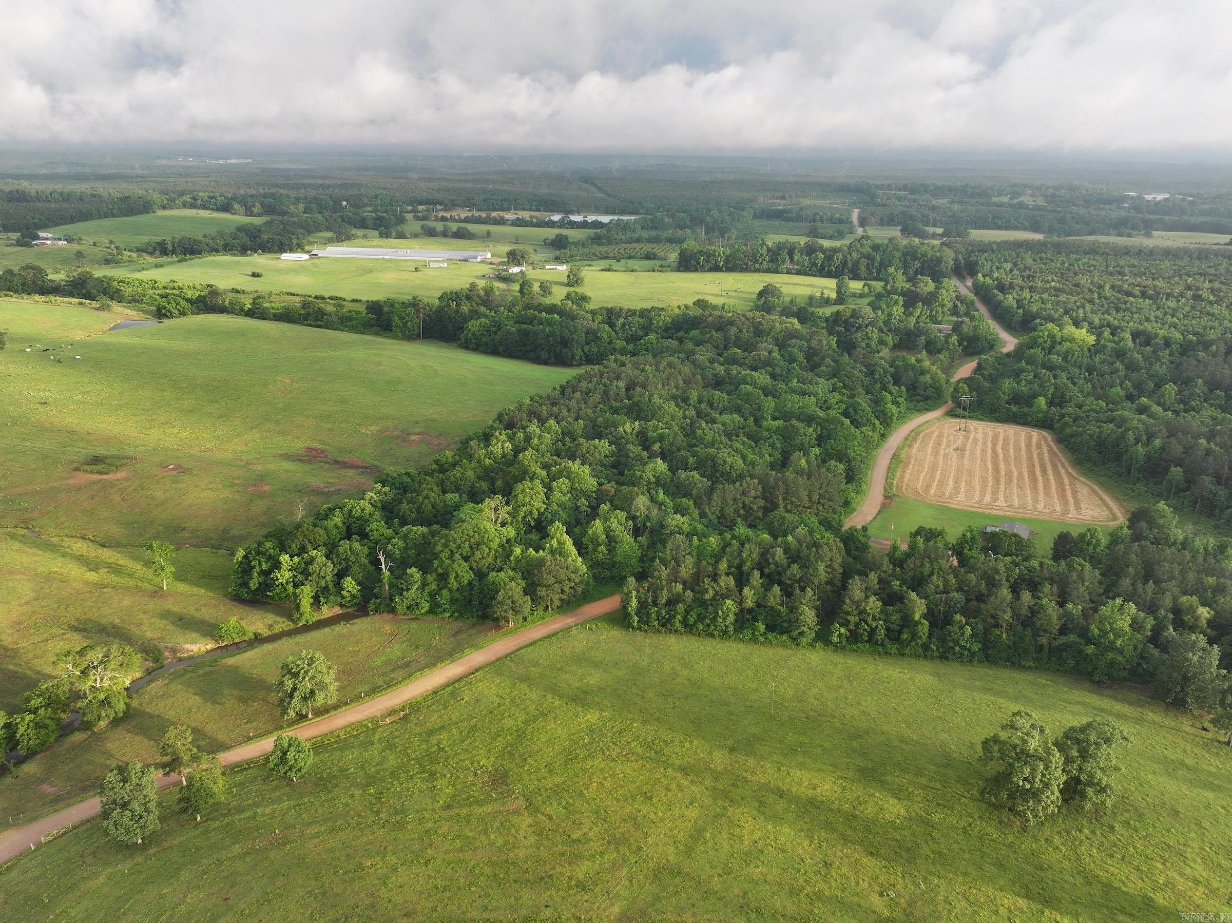 Wooded acreage located just 1.5± miles from the Howard County Wildlife Management Area. This versatile tract features a mix of hardwoods and pines, a natural creek running through the property, and an ideal spot to build a cabin or rural home. With abundant wildlife, itās well-suited for hunting or enjoying nature. The property is also a short drive to Dierks Lake and the Cossatot River, offering opportunities for fishing, kayaking, and boating. Conveniently located near outdoor attractions, this land provides a peaceful, natural setting with great potential for recreation, timber use, or your next building project.