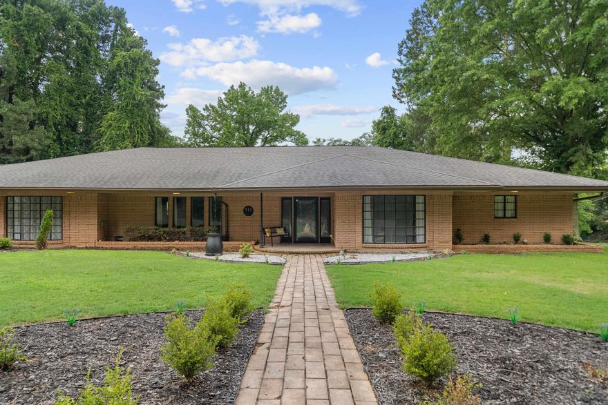 Step back into the 1960s with this beautiful, spacious, one-level home in the historical downtown Hot Springs district. This five-bedroom, 4.5-bathroom house is perfect for entertaining. The updated primary bathroom offers a modern touch, while the rest of the home provides a nostalgic feel. Storage is not an issue here, with major storage throughout and ample walk-in closets in the bedrooms. The heart of the home is the kitchen, featuring a large quartz island perfect for gathering. Adding to the property's versatility is a separate guest house/mother-in-law quarters that could also be used as a rental. Additionally, this home includes a four-car carport, ensuring plenty of covered parking. Experience a blend of classic charm and modern convenience in a prime location.