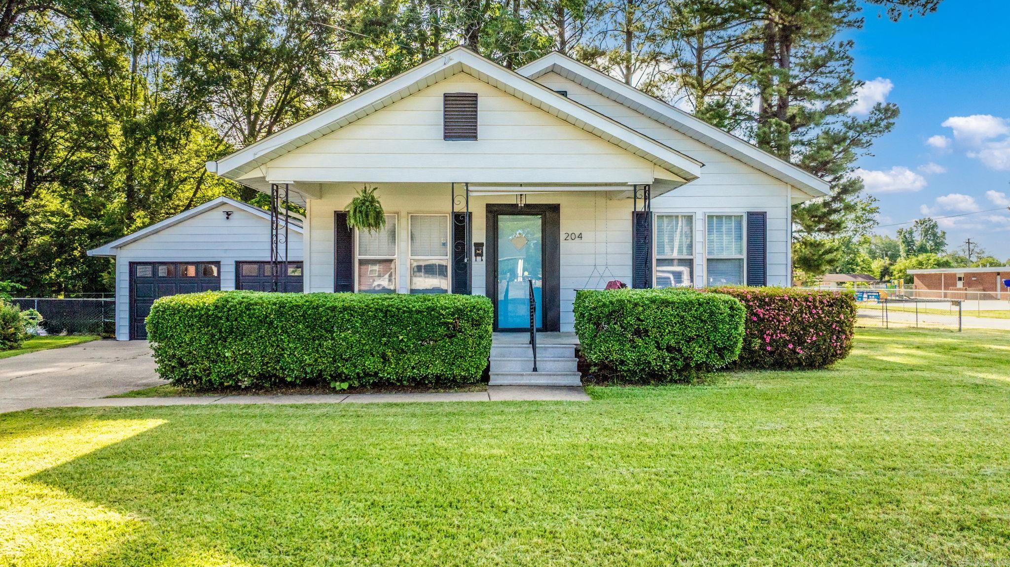 Adorable Just Renovated 2 Bed, 2 Bath on a Massive Corner Lot! With the Seller offering $2,500 towards buyers closing costs, buying down their intrest rate, or a credit towards a personal update/feature. Fall in love with this beautifully updated home just steps from Sallie Cone Elementary, seconds from the Boys & Girls Club, and only minutes to UCA! Sitting on an incredibly sized corner lot, this 2 bed, 2 bath charmer features a new roof (2019), refinished original hardwood floors, new carpet and LVT, fresh interior paint, updated lighting, hardware, and so much more. (All 2025 renovations). Enjoy your morning coffee on the cozy front porch with a swing already in place, or take advantage of the detached two-car garage and extra storage building out back. Whether you're a first-time buyer, student, or investor, this home offers location, charm, and updates all in one. Move-in ready and credits to help with closing costsāthis one won't last long!