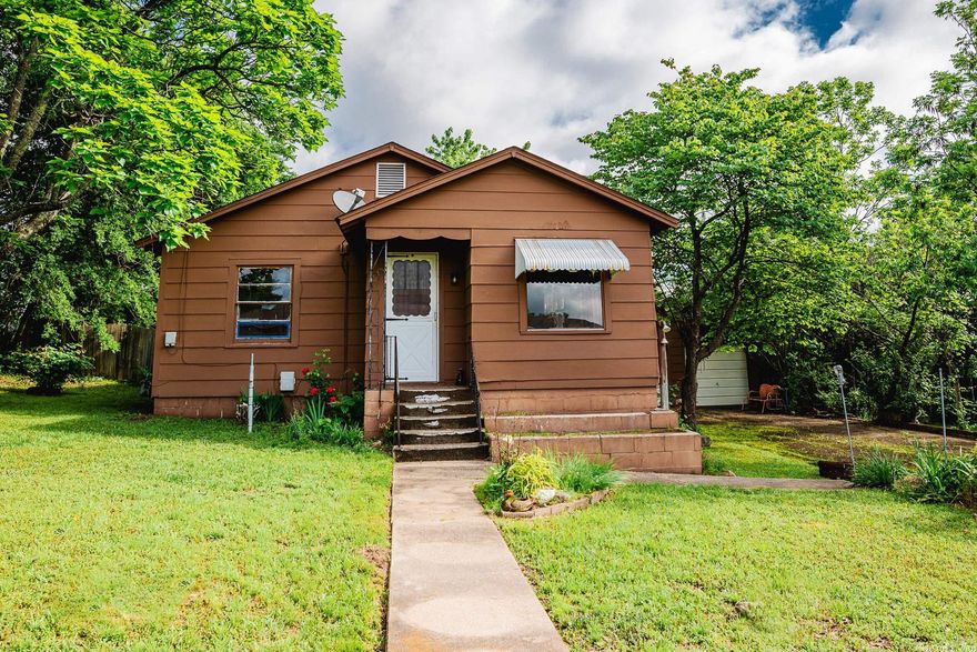 Close to Mena High School is this Charming 2 bedroom / 1 bath Home.  Some updating has been done but Home is to "SELL AS IS".  Detached Garage and Shop provide many extras to this Property!  Large nice Bonus Room off the back of the Home.  Brand New Roof just installed!  See Agent Remarks