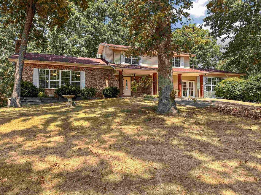 Welcome Home! This spacious home is set on a hill on 2.75 wooded acres, offering a perfect blend of seclusion and comfort. Pride of ownership shines in every detail of this 2,664-square-foot residence with 2184 sq ft heated and cooled. In addition to the main living space, a 480-square-foot bonus room provides flexible space for a home office, gym, or play area. With a spacious and functional floor plan, this home features three bedrooms, two and a half bathrooms, and a cozy living room anchored by a beautiful brick fireplace with a wood insert. The heart of the home, the kitchen, is a chef's delight, complete with all appliances, a pantry, and quartz countertops and sink. The outdoor space is just as inviting as the indoors, featuring an enclosed backyard and an above-ground pool. The attached two-car garage provides convenience and ample storage. Significant recent upgrades include an architectural shingle roof installed within the last year, ensuring peace of mind for years to come. Located less than a quarter-mile from a paved road, this home offers the ideal escape without sacrificing easy access. This is more than a house—it's a sanctuary waiting for you to call home.