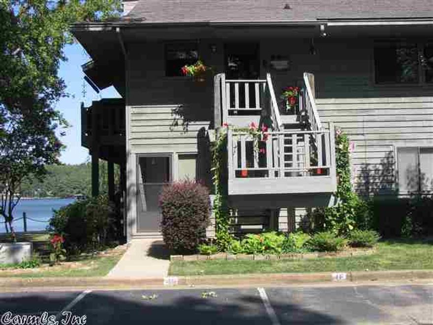 TOTALLY UPDATED, GREAT PRIVATE, AREA, COVERED BOAT DOCK, FIREPLACE, TANKLESS HOT WATER HEATER, DECK SPAN ACROSS AND AROUND THE CONDO WITH A PANAROMIC VIEW OF LAKE HAMILTON,