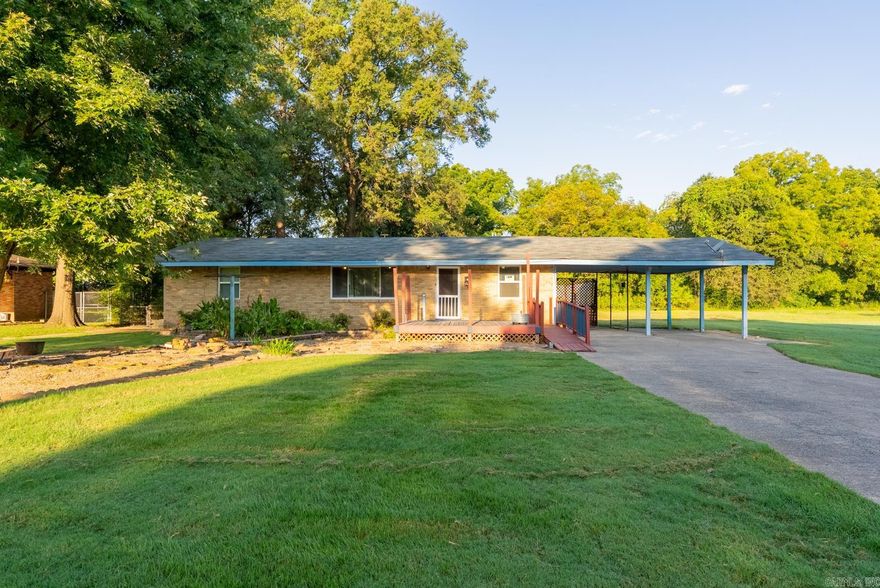Welcome to this well-kept 3-bedroom, 1-bath home sitting on over half an acre in North Little Rock's Meadow Park neighborhood. Featuring approximately 1670SF of living space with original hardwood floors, large windows for natural light, and a separate dining room for family gatherings. The fully fenced backyard includes gated access for RV or boat parking and even a beautiful Magnolia tree just waiting to be admired. Step in through the back entry to a versatile mudroom with plenty of storage along with a dedicated laundry room that keeps household tasks tucked away.  Out front, a cozy deck and extensive landscaping create an inviting first impression. The roof is only 4 years old! Video surveillance system for added security. Check it out today!