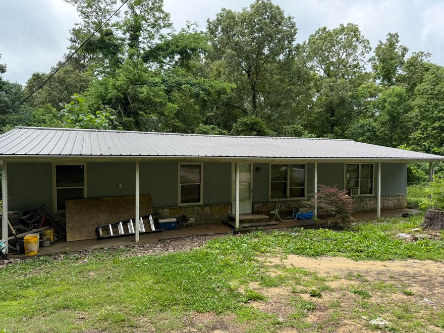 This 3-bedroom, 2-bathroom manufactured home offers 1,248 sq ft of living space on a 1-acre lot. Enjoy the convenience of being in town while still having the privacy and natural seclusion of a spacious yard. With some updates and renovations, this property could make a wonderful first home or investment opportunity. Home is being sold as-is, including appliances. Great location, full of potential — all for just $60,000!