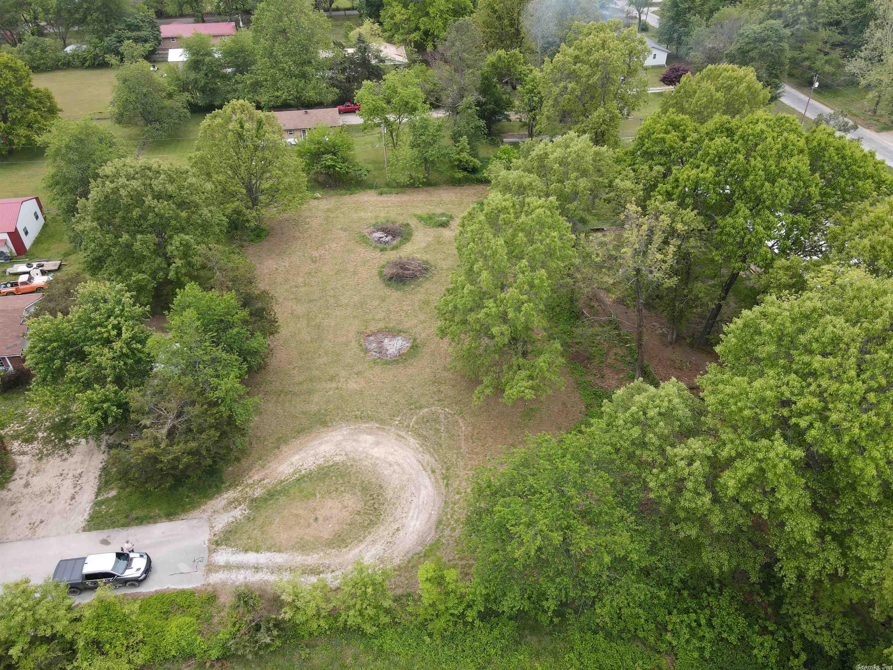 This builder's lot located at the end of a dead-end street in Bergman, Arkansas has all of the amenities on site! Water, electricity and a completed perc test for a 3-bedroom house! Just across the pasture from the school, it sets in a quiet community and is ready for a home! Bring your home plans and start building today!