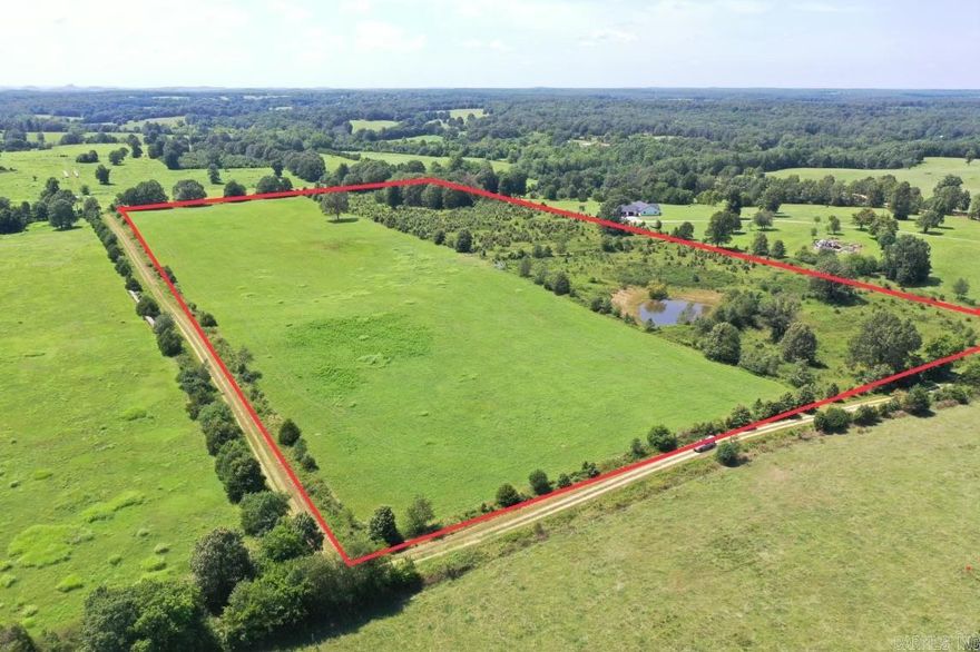 ACREAGE IN THE OZARKS!!  24 unrestricted acres of mostly cleared pasture ground. Producing quality hay each year. Fertilized fields, fully fenced & cross fenced with large pond. Great property to run cattle, horses, or have a hobby farm. Several Building sites and conveniently located near Melbourne School and Golf Course. This place has many possibilities!