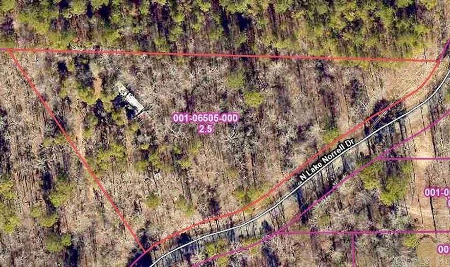 Wooded lot 2.5 acres +/- in the Lake Norrell area.