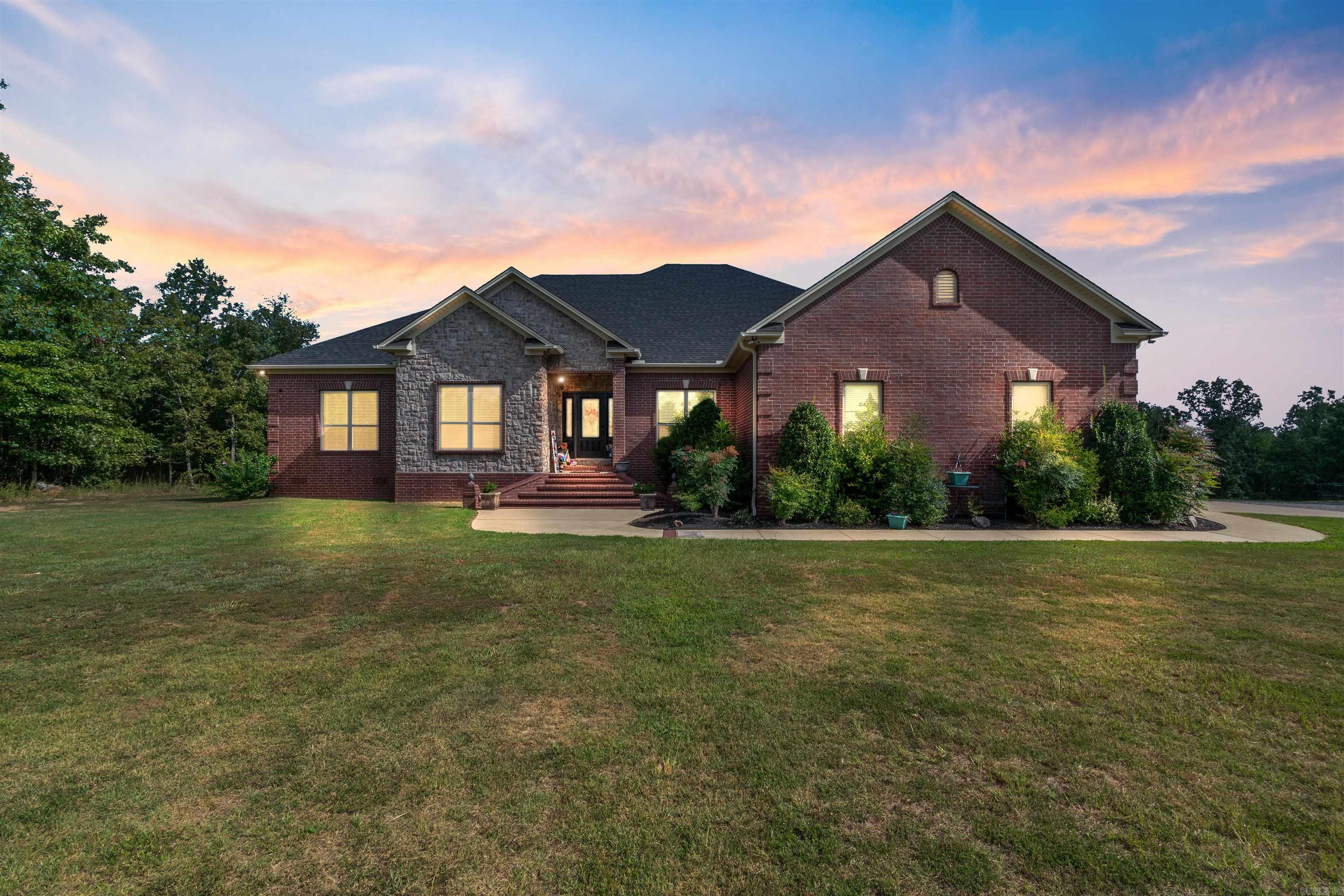 Discover the life of luxury & relaxation in this expansive estate nestled on 5ac of picturesque beauty. Grandeur & comfort on a ridge of panoramic views that will take your breath away. Int offers gourmet kitchen w Alderwood cust cabinets & slow close drawers & doors throughout. Granite counters, SS appl, commercial refrig, farmhouse sink & more! 5BR!. Baths have poured Marble. Every room has a view! Very lg safe room downstairs w a smaller safe inside-FEMA app. Relax on the massive covered back porch and count the hummingbirds! HVAC is geothermal w 3 zones-what an upgrade! Shop is an expansive 50x60 & is a haven for hobbyists & tinkerers alike. Whether youre a woodworker or simply need extra space this is the perfect place! Above the shop there is a private in-law quarters w appr 1300 SF- 2BR/1.5 Ba w small office, also has silestone counters. Shop has 220V for camper hook up w sm sewage hook up as well. Roof/gutters new in 2022. With its harmonious blend of sophistication & beauty this home is more than a home-it's a lifestyle of paradise & country escape. Many more upgrades than listed - agents see remarks & attached amenity sheet