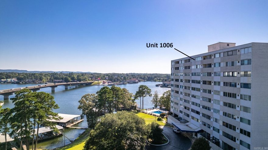 This 1 bedroom / 1 bathroom Mini Penthouse is perched on the 10th floor of Lake Hamilton's only High-Rise Condominium complex. The unit comes furnished (with some exceptions). Completely redesigned floor plan to maximize the space. Walk in shower off the bedroom area. All counter tops and vanity areas are brilliant, neutral granite. The open balcony and large frameless bedroom window both have some beautiful Lake Hamilton and Vista views. The two electric fireplaces are remote controlled. The TV swivels to the living or bedroom area. The sofa is a fold out bed, but who wants to share this place! The owner has lived there and has had it rented both long and short term at times. Dock #4 and boat stall #6 to convey with sale and there is an assigned Covered parking spot, G7. There is a secure trailer parking area for owners and guests inside the security gate.  The grounds include tennis courts, large pool area on the lake front. The clubhouse has two large gathering rooms which can be reserved.  Two large grills are located out on the patio area by pool. There is a game/workout room as well as a large laundry room in the basement area leading to the pool.  Boat Stall inclluded.