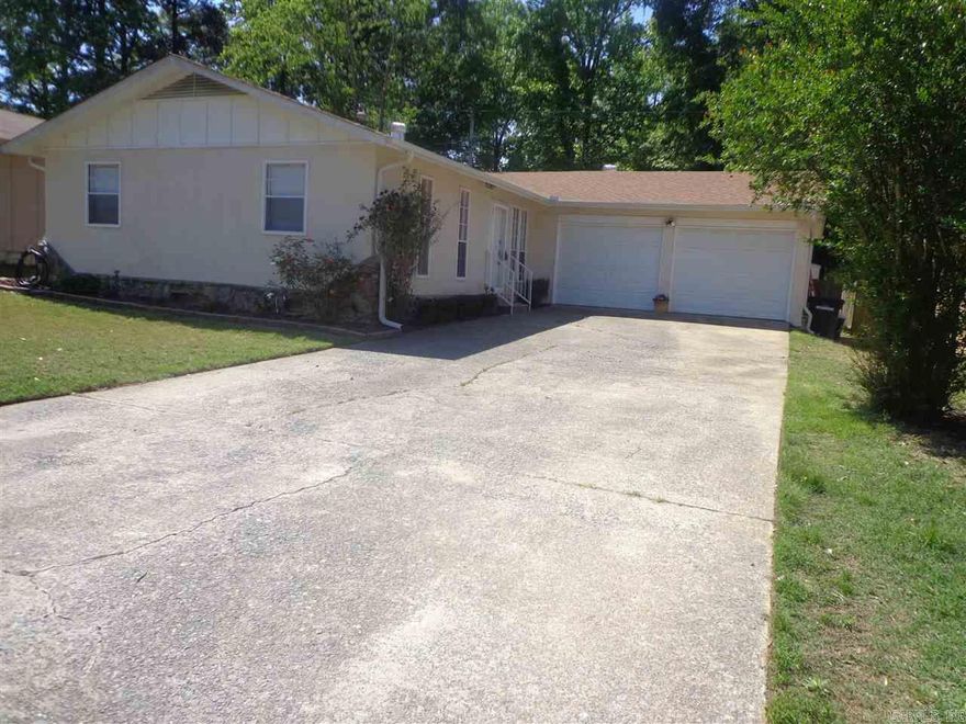 Beautifully updated home with fabulous curb appeal!  Gorgeous newly installed granite counter tops, new laminate, newly renovated bathrooms, and within walking distance from the lake, park, and playground.  Huge garage and shop in the back.  Cute decking in the back to BBQ! Come take a look!