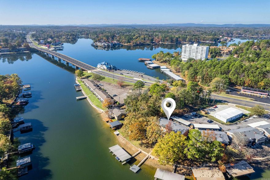 Beautifully remodeled Lakefront condo with covered boat slip just steps from the water's edge. This 2 bedroom has an open concept kitchen/dining/living area with fireplace as well a 1/2 bath for your guests. Spacious bedrooms and a bath upstairs.  You'll enjoy hanging out on your back patio while grilling and chilling with your favorite beverage of choice. Easy access to shopping, restaurants and the bypass. Just in time to get settled in for 2025 lake season. 30 day minimum rental restriction.  No nightly rentals allowed.