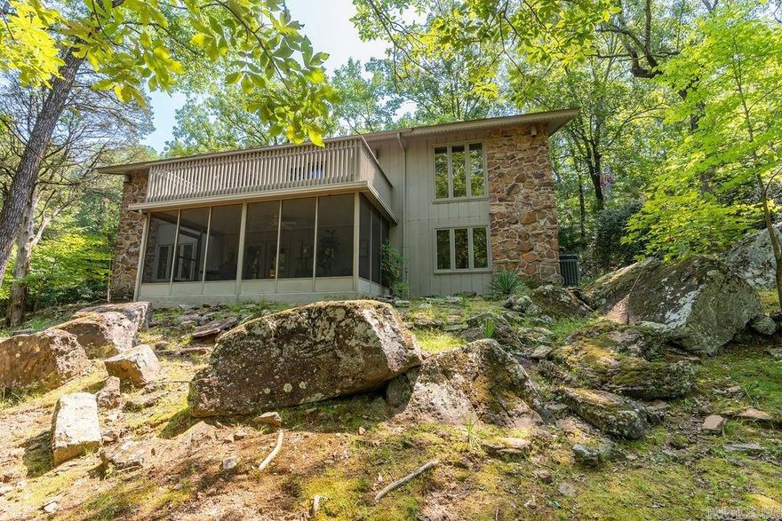 You will love this charming home in Eden Isle just minutes from Marina and Greers Ferry Lake!! This home has 2 living areas.  Beautiful stone fireplace with gas logs. Dining room to entertain plus a breakfast nook overlooking beautiful backyard.  Grilling deck with natural gas grill. Screen in porch and deck that has winter views of the lake.  Office space.  Very well maintained home.