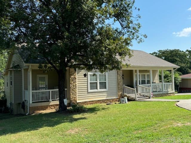 Very unique opportunity to own a spacious 5 bedroom, 3 bath home located on one acre, 1 block from Lake Hamilton. The fabulous floor plan creates the ultimate setting for family living and entertaining with a large open kitchen, eat-in bar, and dining area which flows into the den. The den has a fireplace, vaulted ceilings, and opens to a large deck. The 5th bedrooom located on the ground level can be used as an apartment, mancave or mother-in-law's quarters. The double garage has additional storage. New hotwater heater and roof in 2023. Square footage has been updated and increased based on recent appraisal. A repair allowance for Patio and privacy fence with an acceptable offer.