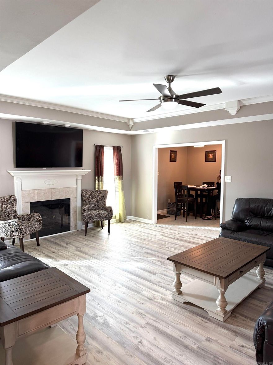 Welcome to a home where “well-maintained” truly meets “fully reimagined.” This beautifully updated 3-bedroom, 2-bath split-plan home offers both style and privacy. The designer kitchen is a true showstopper, complete with new quartz countertops, a custom tile backsplash, stainless steel appliances, and double ovens — perfect for anyone who loves to cook or entertain. The thoughtful split layout enhances privacy, a dedicated laundry room adds everyday convenience.The guest bath has been completely remodeled and showcases a seamless, modern walk-in shower with stunning tile work.  New LVP flooring, fresh paint, updated light fixtures, and remote-controlled ceiling fans add both comfort and style.  Just in time for Spring, step outside to a brand-new wooden deck with elegant wrought iron railings overlooking a fully fenced, private backyard — ideal for relaxing or entertaining. The exterior is just as impressive, featuring beautiful storm doors, gutters with gutter guards, and meticulous upkeep. Major updates provide true peace of mind, including a new roof (2023), replacement windows throughout, and new HVAC (2025). Call to see this one before it is GONE!