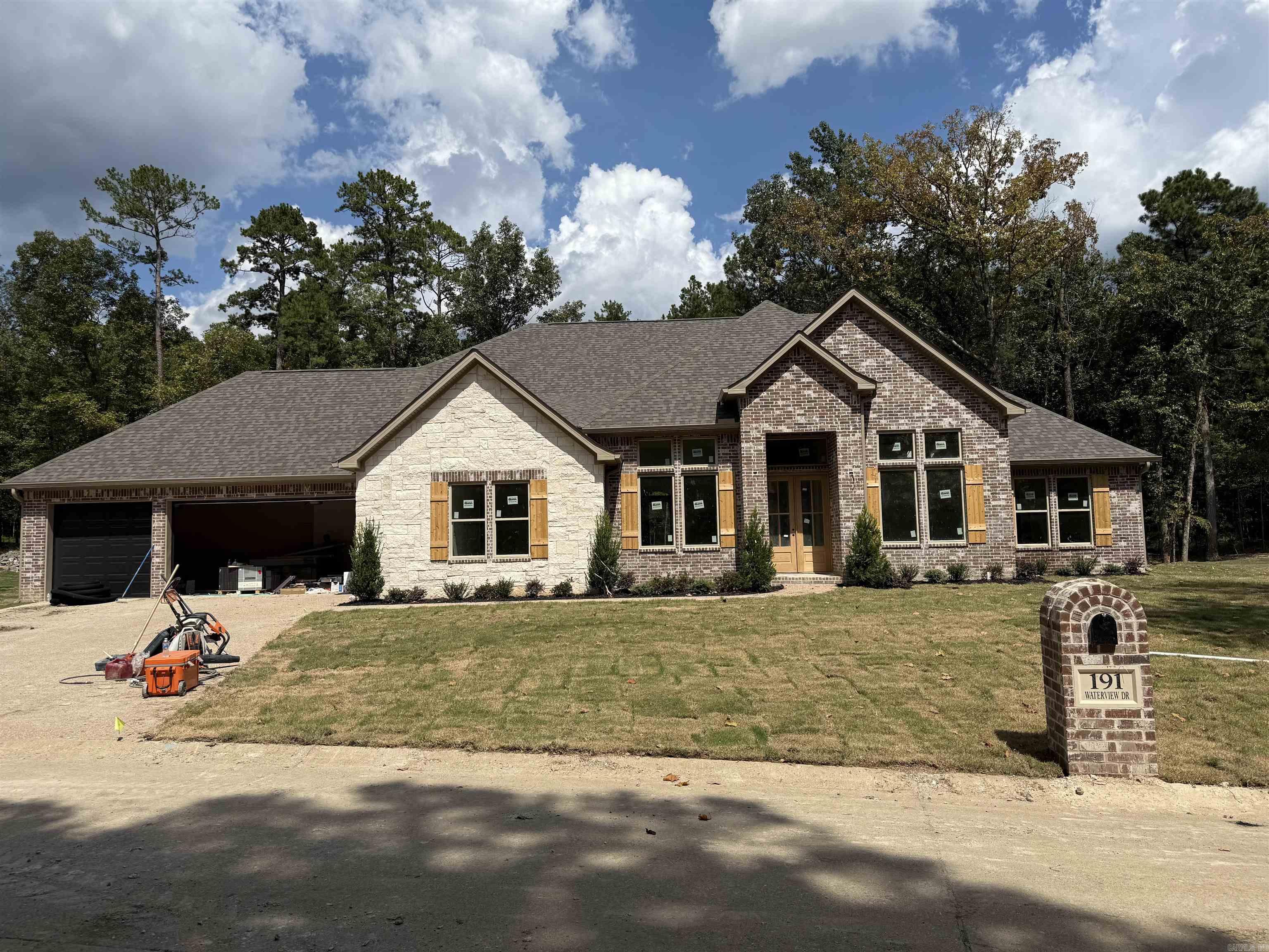 New Construction in Highly Desired 7 South location. Stunning Home with the features you are looking for. Special Wall Moulding add charm to this open floorplan that welcomes your family and guests. Enjoy cozy holidays around the fireplace. Large granite island in the chef’s kitchen, double ovens and custom cabinets. The primary bedroom features walk in closet and ensuite with luxurious finishes. Stairs to attic for storage. Deeded lake access. Lake Views , across the street from Lake Hamilton. Estimated completion Fall of 2025.