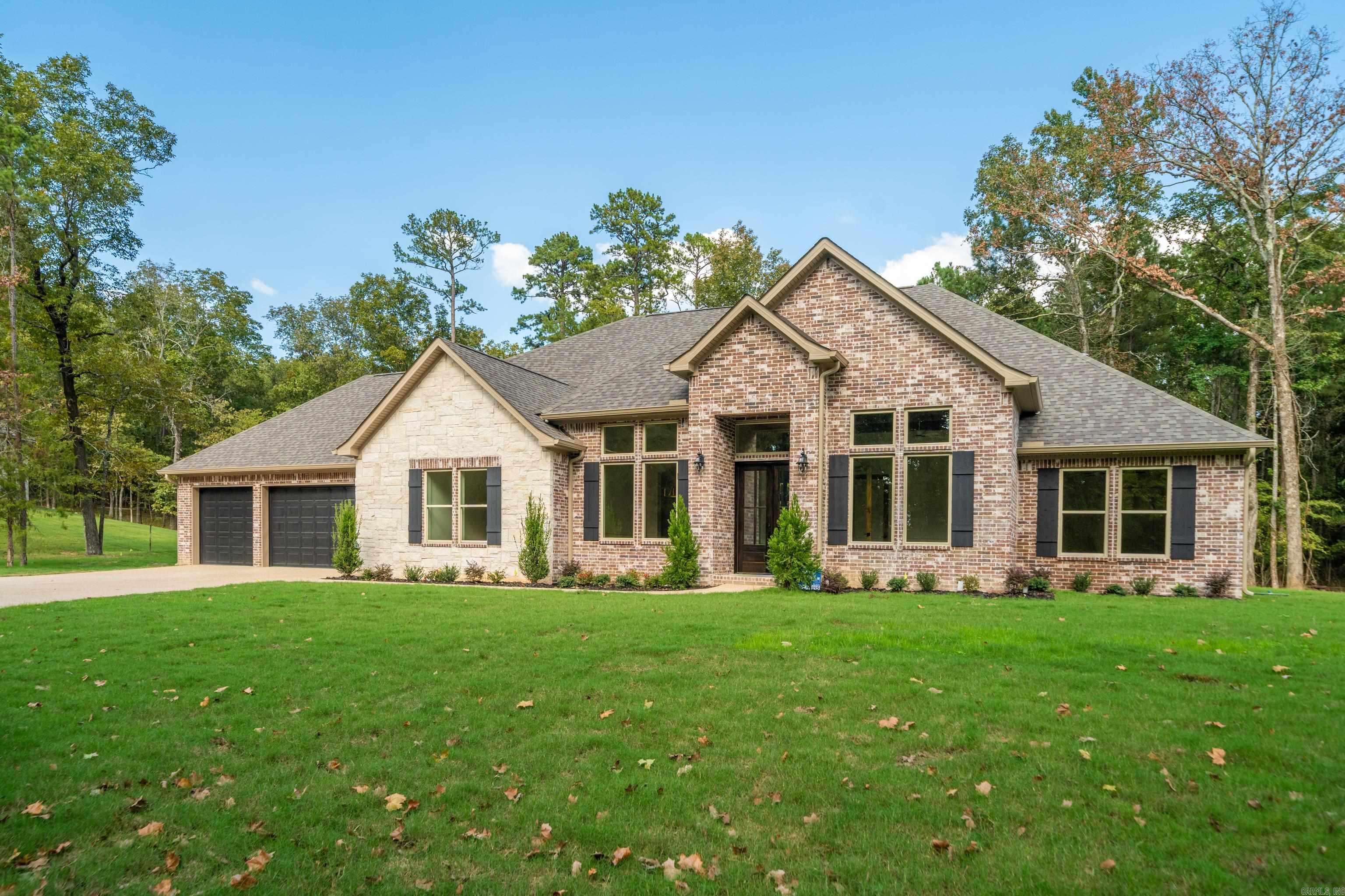 New Construction in Highly Desired 7 South location. Stunning Home with the features you are looking for. Special Wall Moulding add charm to this open floorplan that welcomes your family and guests. Enjoy cozy holidays around the fireplace. Large granite island in the chefās kitchen, double ovens and custom cabinets. The primary bedroom features walk in closet and ensuite with luxurious finishes. Stairs to attic for storage. Deeded lake access. Lake Views , across the street from Lake Hamilton. Estimated completion Fall of 2025.