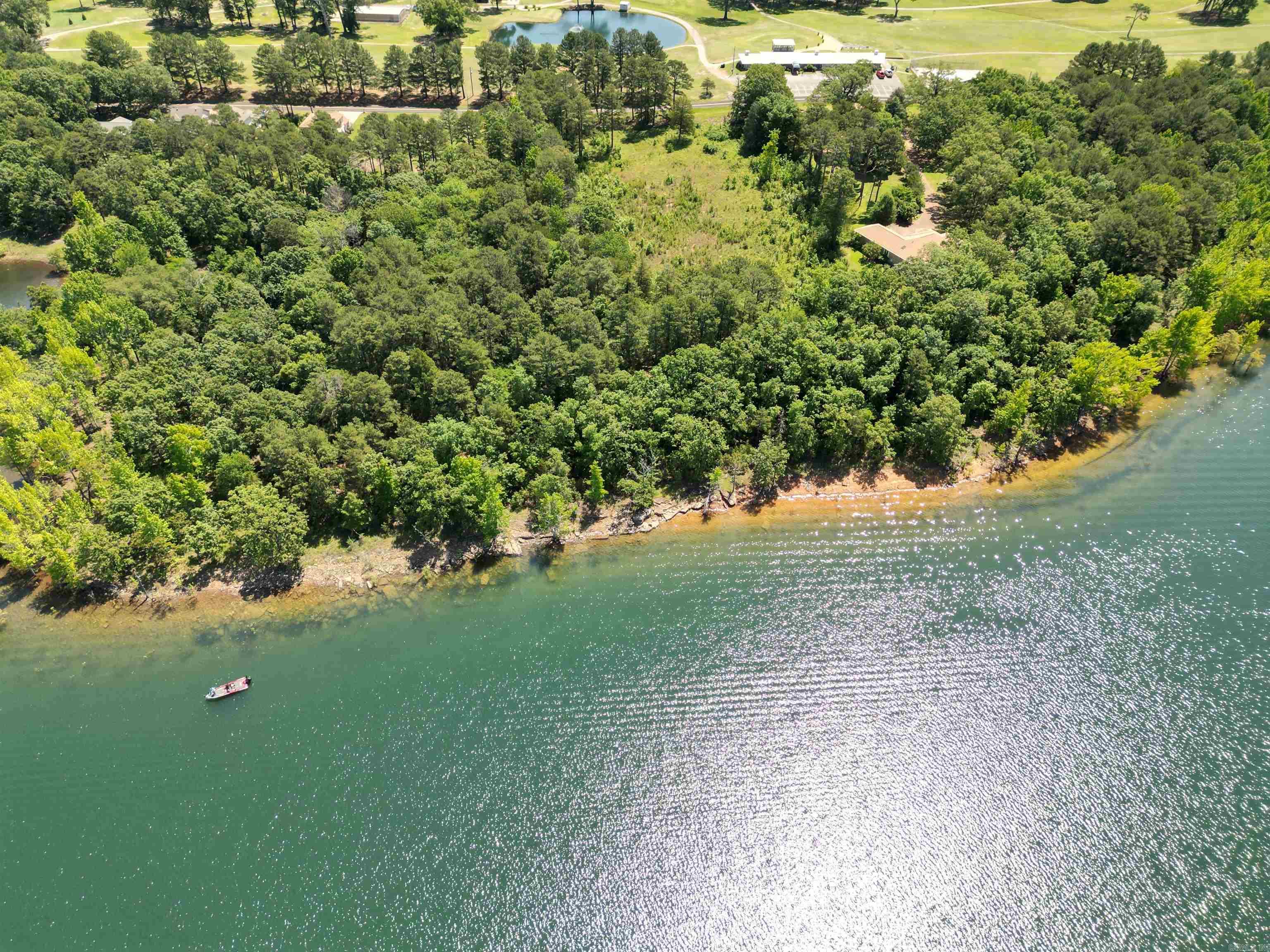 RARE 3.43 acres on spectacular Greers Ferry Lake, across the street from Thunderbird Golf and Country Club. Inside city limits with all city amenities and services. 290' of lakefront (adjoining US C of E "white line"). Minutes from world-class trout fishing on the Little Red River and multiple full service marinas on the lake. Level property, easy build for your dream house! This property is not in a subdivision and is not subject to subdivision restrictions (still subject to city zoning, codes, etc).