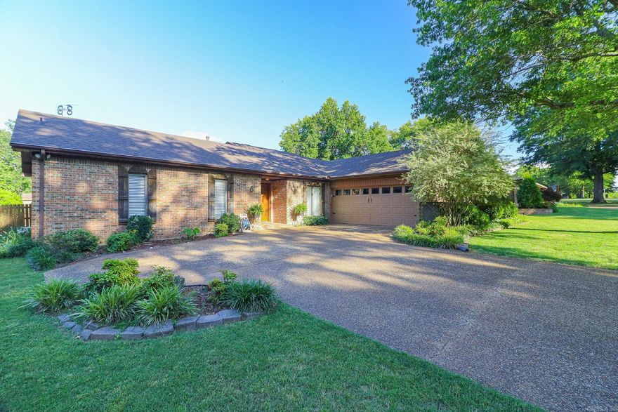 Stunning 3-bedroom, 2.5-bath, 2,076 sq ft home in a quiet, established neighborhood with mature shade trees. This home combines classic charm with comprehensive modern updates, including a remodeled kitchen with quartz countertops, new appliances, added gas stove line, and fresh cabinet hardware. The living room is warm and inviting with vaulted ceilings, exposed beams, and a gas fireplace. All bedrooms and bathrooms have been updated with new flooring, fixtures, blinds, door hardware, and fresh paint, including a primary suite featuring a walk-in shower. Additional updates include new light fixtures, ceiling fans, skylight replacement, and updated half bath. Outdoor spaces shine with a screened porch, extended concrete patio (2023), fenced backyard, modified fence for garage access, new shed door, and 220V outlet for convenience. A new roof was installed in 2024. Move-in ready with upgrades throughout, blending comfort, style, and functionality.