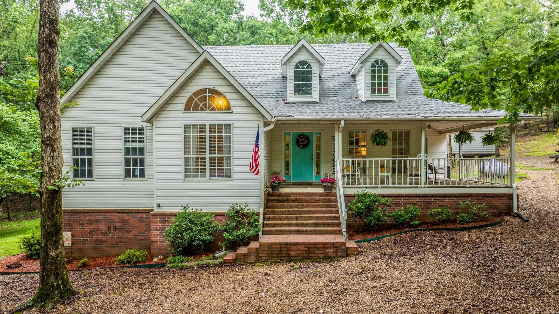 Experience the best of country living in this beautiful home nestled on five serene acres! Enjoy peace and privacy without sacrificing convenience - just six miles from all the shopping and restaurants West Little Rock has to offer! The open concept living/dining/kitchen with tall ceilings brings in ample natural light and a feeling of grandeur. Your primary suite features a walk-in closet, spacious double vanity with shower and soaker tub. Just off of your modern kitchen is a great flex space that would be ideal for those wanting a reading retreat/office or great location for all your kiddos schooling needs. Upstairs you will find two more great spaces that can be bedrooms or bonus areas with a half bath in between. Step outside to find endless possibilities - plenty of room for a garden, animals, or even a future pool or shop. Whether you are sipping coffee on the wraparound porch, or exploring your acreage, this property offers the space and freedom to live your dream lifestyle. A move-in ready gem combining rural charm with modern comfort. Don't miss your chance to own a slice of country paradise! Roof - 2022; Upstairs HVAC - 2025; (Agents see remarks for additional updates)