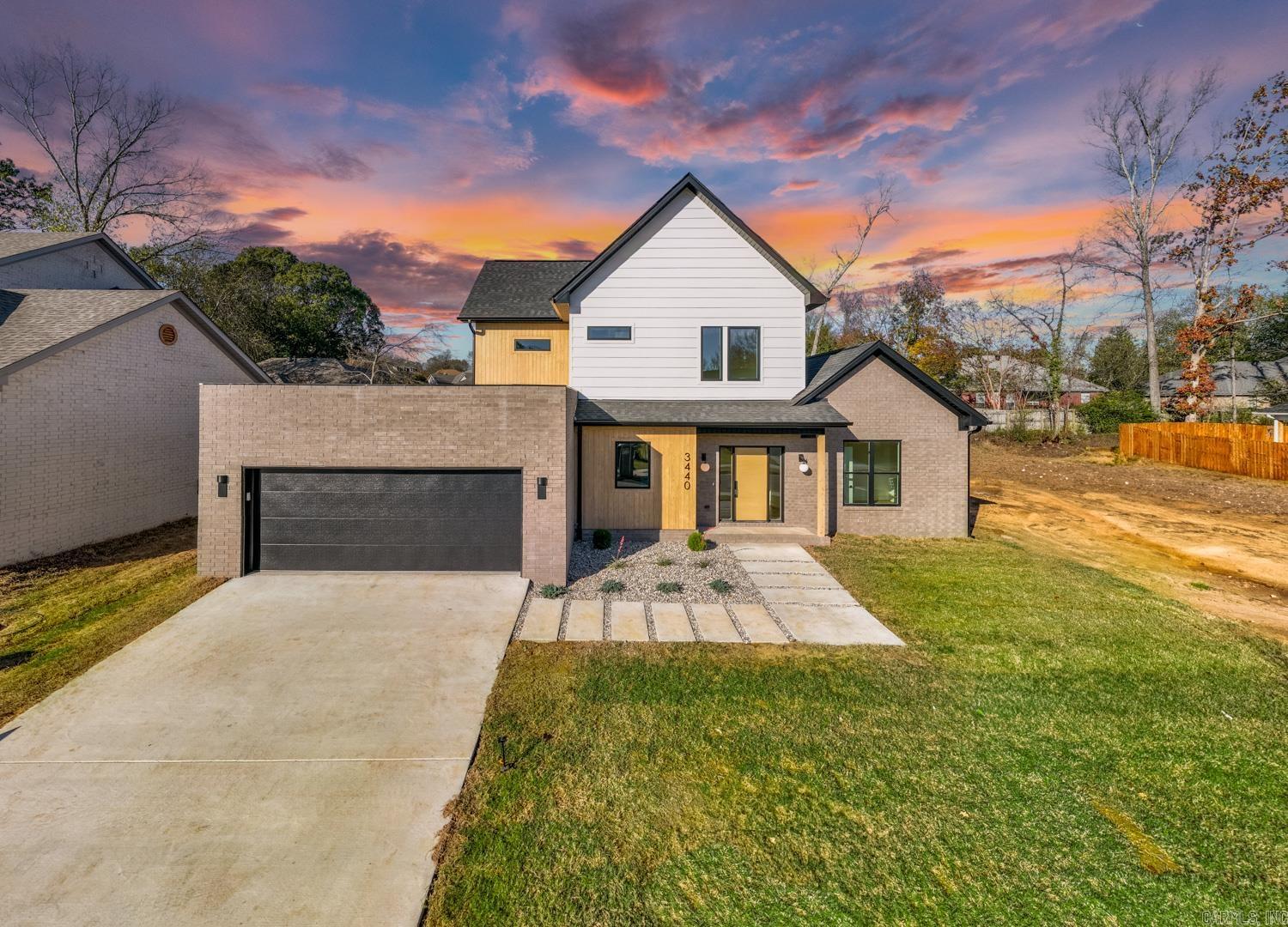 What a fabulous home! There are so many personal touches added to this home. The designer has thoughtfully picked out the interior and exterior of the home to offer a unique home. There will be no other home that will have this style. NO cookie cutter homes for this builder. The kitchen is a dream with custom cabinetry and pantry that includes a door for loading the groceries from the garage for the utmost convenience. The ceiling in the living room is as high as the second floor which gives the room an expansive feeling. It also has custom lighting giving the room a quiet ambiance. The primary bedroom with a luxurious ensuite is perfect for an at home spa day. Guest bedroom downstairs as well that could also be used as an office. Upstairs are 2 spacious bedrooms with large closets and a guest bathroom. Large covered patio. You will want to see and own this home. The location is fabulous as well within easy access to the biking and walking trail that weaves through the city.