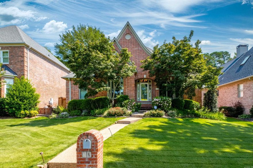 Beautiful patio home on private lot with rear entry from private drive.  Two story entry.  Large great room with wood burning fireplace.  Open kitchen has slab granite with table area, large island, and den (this was formal dining).  Master suite with luxurious master bath completely updated including two closets.  Main level with two additional bedrooms have hall bath.  Separate half bath and laundry rooms.  Upstairs with large bedroom or bonus room has full bath.  Gigantic walk-out attic storage.  Sunroom opens to flagstone patio with room for fireplace, couch and umbrella table.  Come see!