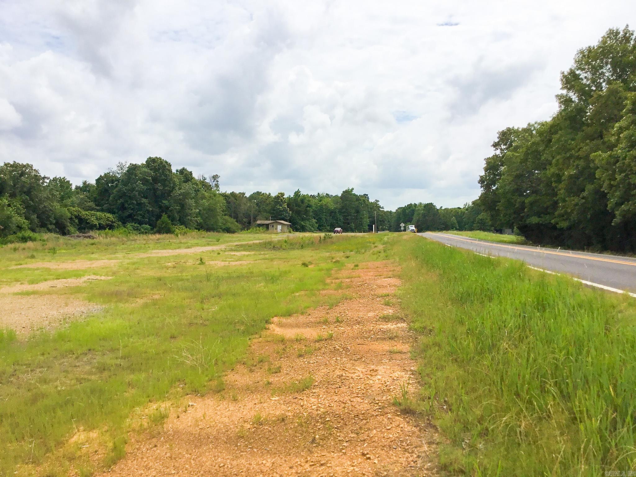 This property is located on Highway 25, just outside of Heber Springs in Cleburne County, and has residential and commercial potential. The property features approximately 1,345 +/- feet of paved road frontage with access to utilities. Around 3+/- acres along the highway have been cleared and could be developed. The tract also has wooded acreage on the eastern portion of the property. The topography is flat for the area, and all of the acreage could be utilized. The tract is just 4 miles from Heber Springs, 39 miles from Conway, and 44 miles from Batesville.