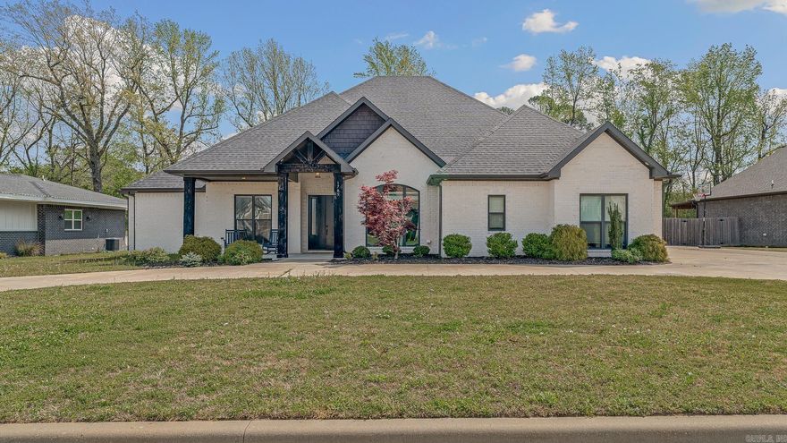 Prime Location! This beautiful home sits on a .40 acre lot with 4 bedrooms and 3.5 baths. Insane curb appeal with side entry 3 car garage and a circle drive. Inside you will find an open floor plan with gas log fireplace, formal dining room , pantry, upscale appliances, vaulted ceilings and LVP flooring. All 4 bedrooms are located on the main floor with a large bonus room upstairs with its own bathroom and spacious closet. The primary suite is so spacious with a pretty ensuite bathroom, separate tile shower and tub and walk in closet. Covered porch out back with automatic screens and a privacy fenced in backyard!