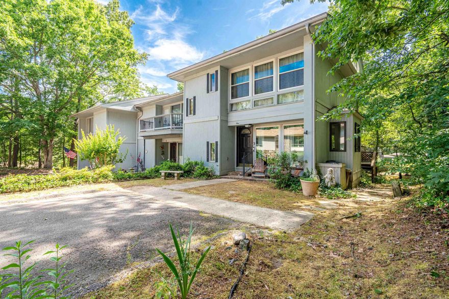 This adorable end-unit townhome is in the popular Castellon Courts at Lake DeSoto.  This unit comes with 2 parking spaces right in front.  Large windows as you enter, gives a bright & sunny feel.  The main level has the living room, dining area, kitchen and half-bath with a sliding door to enjoy the back deck.   Upstairs are two bedrooms, EACH with a toilet/sink room, and a Jack-n-Jill type  bathroom/shower is in between the two.   Downstairs you have the 3rd bedroom, which is large enough to also use as a large Den/TV/Bonus room.  There is a full bathroom with a shower and the laundry area (newer washer & dryer convey).  The sliding door from this room also goes to a 2nd patio area for some nice privacy. This home has been used as an Owners weekend retreat, as well as nightly rental, so it would make a good investment property.  ALL furniture & furnishings are available to purchase, making it move-in ready! Castellon Courts sits at Lake DeSoto and this property is an easy walk to the water.  There is also a common area for gatherings to sit and enjoy the peaceful setting.  Lake DeSoto marina is next door where you can rent a pontoon boat, have some food/wine.   AGENTS see remarks.