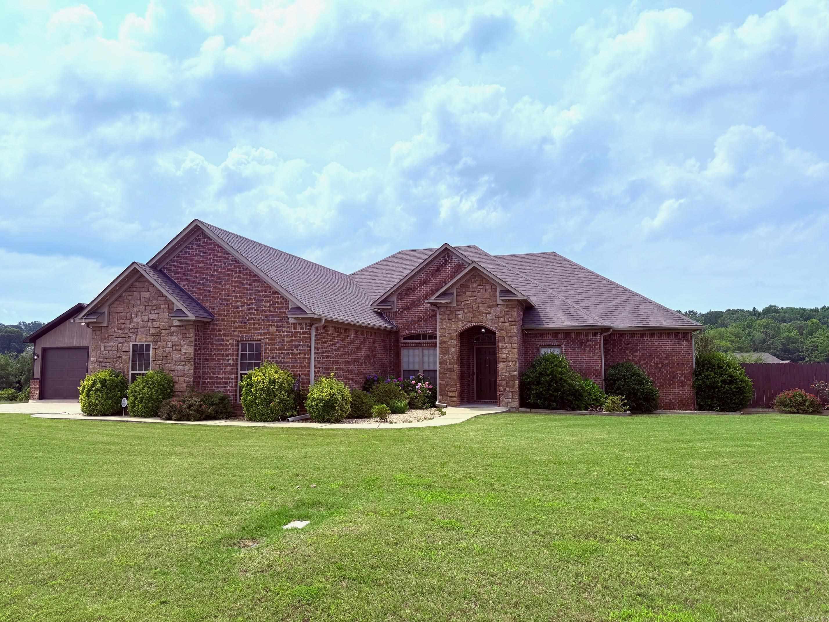 Beautiful home features a 20x20 shop on .8 of an acre in Huntington Estates! Enjoy never having an electric bill again with these new solar panels! 4 bedrooms, 2 baths, new roof 2023, new HVAC 2021, new carpet 2023 and new fireplace too! Granite counters, stainless steel appliances, and beautiful stained concrete floors. Large fenced in backyard and covered patio make this a perfect home for entertaining or quiet enjoyment!