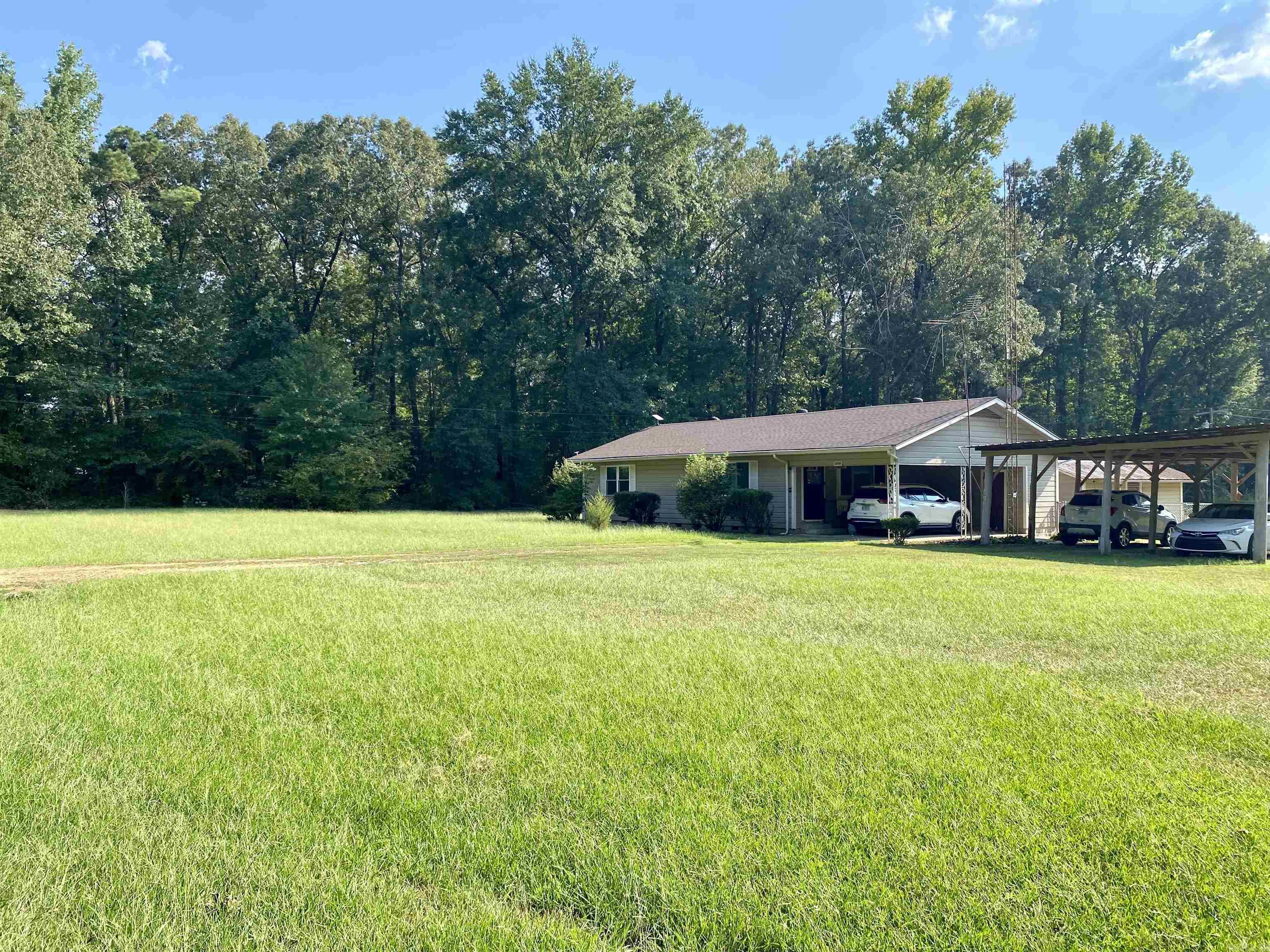 Charming MOVE-IN Ready Home in Cleveland County - Priced to SELL! This adorable 2-bed 1-bath home in Pine Bluff (Cleveland County) has been completely remodeled and is truly move-in ready! Featuring a brand-new kitchen with granite countertops, soft-close cabinets, and recessed lighting. Open floor plan. LVP Flooring though out. New windows. Fully renovated bathroom. Covered back porch is perfect for relaxing. One-acre lot with a partially fenced backyard and a cute workshop. Enjoy the flexibility of optional school districts - choose between Star City SD & Woodlawn SD. Don't miss this one - it's priced to sell & won't last long!