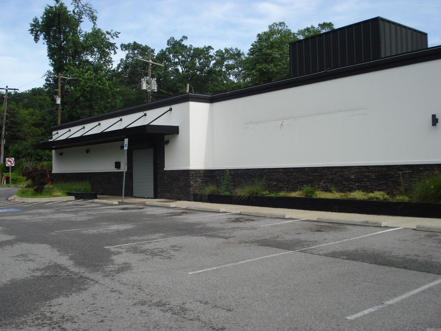 Nice Solid Building at Bottom of Cantrell Road! Great Location, High Visibility! Zoned Commercial.