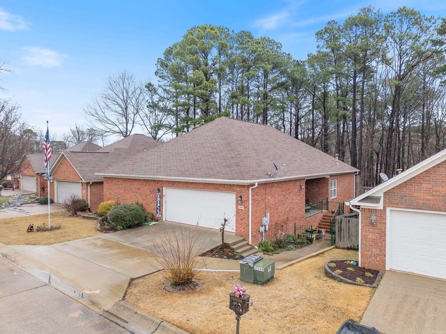 Soak in the forest views from the expansive deck across the entire back of the home, with covered BBQ area!  Or enjoy the view from the huge family room with windows across the entire back of this gem of a garden home!  With a kitchen made for a cook including a center island, breakfast bar and a custom one of a kind pantry unit you will be cooking up memories and great meals for the entire family.  Enjoy the breakfast nook or sit outside on the covered patio steps away from your flower garden for your coffee!  When it’s time to have family and friends over for a game night or great meal, you are set with a formal dining area and large living room with gas burning fireplace.  End the day in a large master suite, complete with walk in jetted therapy tub and a walk in shower.  The large master closet offers ample room for all your best outfits and accessories.  Enjoy the split floor plan that offers two additional bedrooms at the opposite end of the house with a large full 2nd bathroom in the hall.   Add in the huge storage area and shop off the lower level and a large 2 car garage and you will never want for storage solutions.  Handicap Accessible.  Roof & HVAC new in 2018