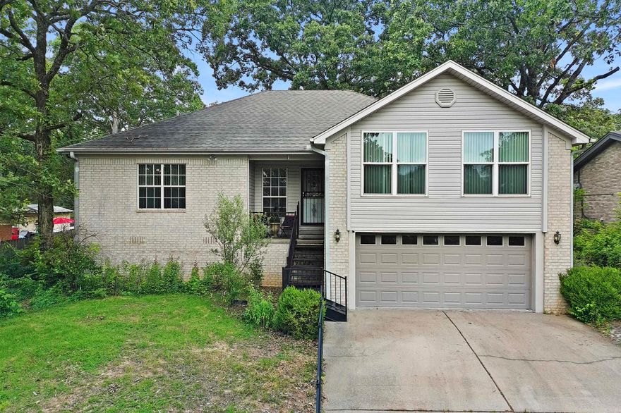 Put your own special touch on this versatile traditional in highly sought Park Hill! Split open floorplan with tray ceilings, crown mouldings and laminate floor throughout most of the house. The main living area features a fireplace with gas logs. Eat-in kitchen has a tiled floor, central island, granite counters, ample custom cabinets, a pantry, and a dining area with lots of natural light. Primary bedroom has a tray ceiling and an ensuite bathroom with a tiled floor, tiled shower, double vanities, and a large walk-in closet. There are generous walk-in closets in all bedrooms. Additionally, there is a large bonus room/den with a walk-up attic for extra storage. The backyard features extra landscaping, a rock walking path, and a large fenced deck which is great for outdoor entertaining and enjoying nature!!  Call today for your private showing!!