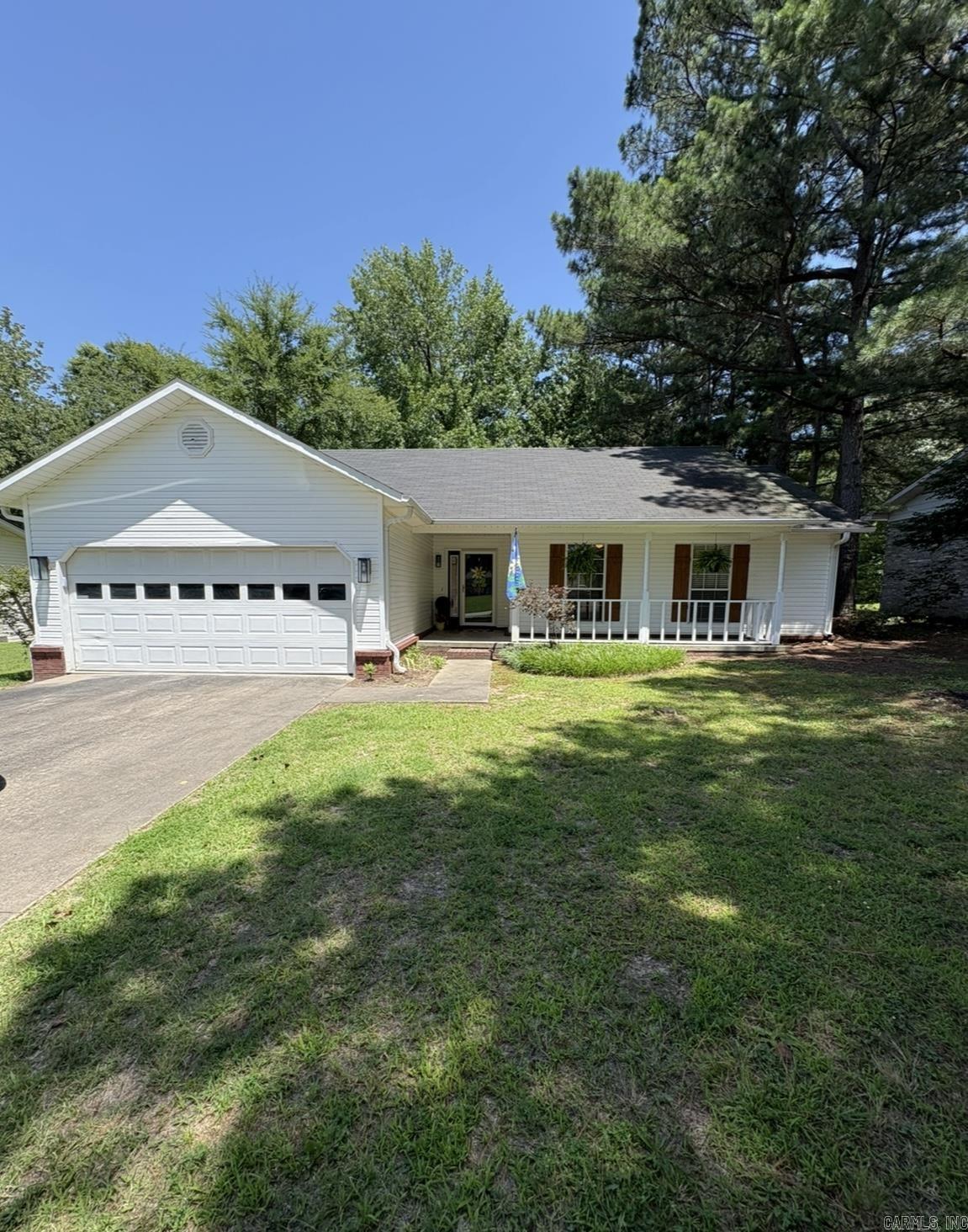 Three Bedroom, Two Bathrooms, Two car garage and a large fenced in backyard. Freshly Stained deck. Nice porch on the front of the house. Shade trees in the front and back.