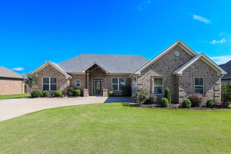 Clean and updated home with 3 bedrooms, 2 full baths with hand-scraped, hardwood flooring throughout!  This home has a large living room with that is open to the kitchen.  Kitchen has stainless steel appliances, under-counter lights, and granite countertops.  Bedrooms are split with 2 on one side of house with a bathroom.  There is hardwood in the bedrooms too!  The primary bedroom has hardwood floors & tray ceiling.  Primary bath has double vanities, tile shower & jetted tub.  It also has a large closet!  Guest bedrooms are large. Front guest bedroom has a vaulted ceiling with walk-in closet.  2nd guest room also is large with a walk-in closet.  Outside is a LARGE covered back patio with a nice backyard!  New roof in May 2022.  Tankless hot water.  New paint in 2021.  Additional flush lighting added in living room & kitchen in 2021.  Additional concrete was added to back patio in 2022.  Call today for a showing!