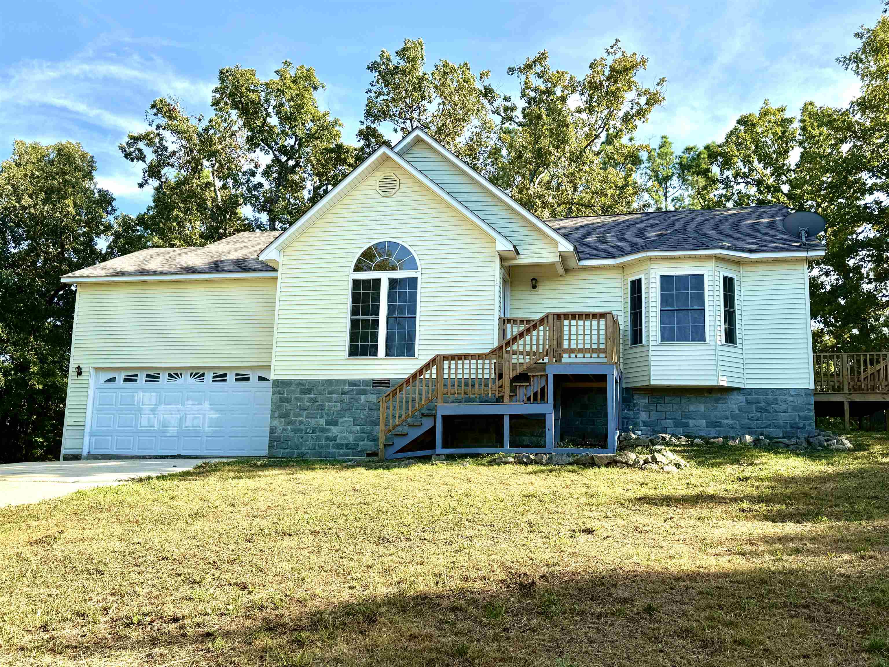 Tucked away on a cul-de-sac near Lake Chanute is this stylish 1-level home with a large 420sqft 1-car garage. Built in 2009. This home is very spacious and freshly painted throughout (excluding garage). Central HVAC. 3 bedrooms, 2 bathrooms, (one of which has a walk-in shower and a jetted tub!) large livingroom with a bay window, kitchen with lots of cabinet space and a bar & dining room with french-doors leading out to a porch. Tile flooring in kitchen, dining, laundry area, and bathrooms. Laminate flooring in all other rooms. All electric and there is a security system installed. Stainless steel dishwasher stays. Ownership of this beautiful home comes with access to Cherokee Village amenities which includes 7 lakes, 2 golf courses, South Fork River, parks, walking trails, tennis court, community center with work-out equipment, pickleball and miniature golf & swimming pools to name a few. Holiday festivities throughout the year and other local town activities give our residence plenty to do in any season. Many tourists enjoy our beautiful Spring River where you can kayak or canoe, fish or swim. Make our wonderful community your home!