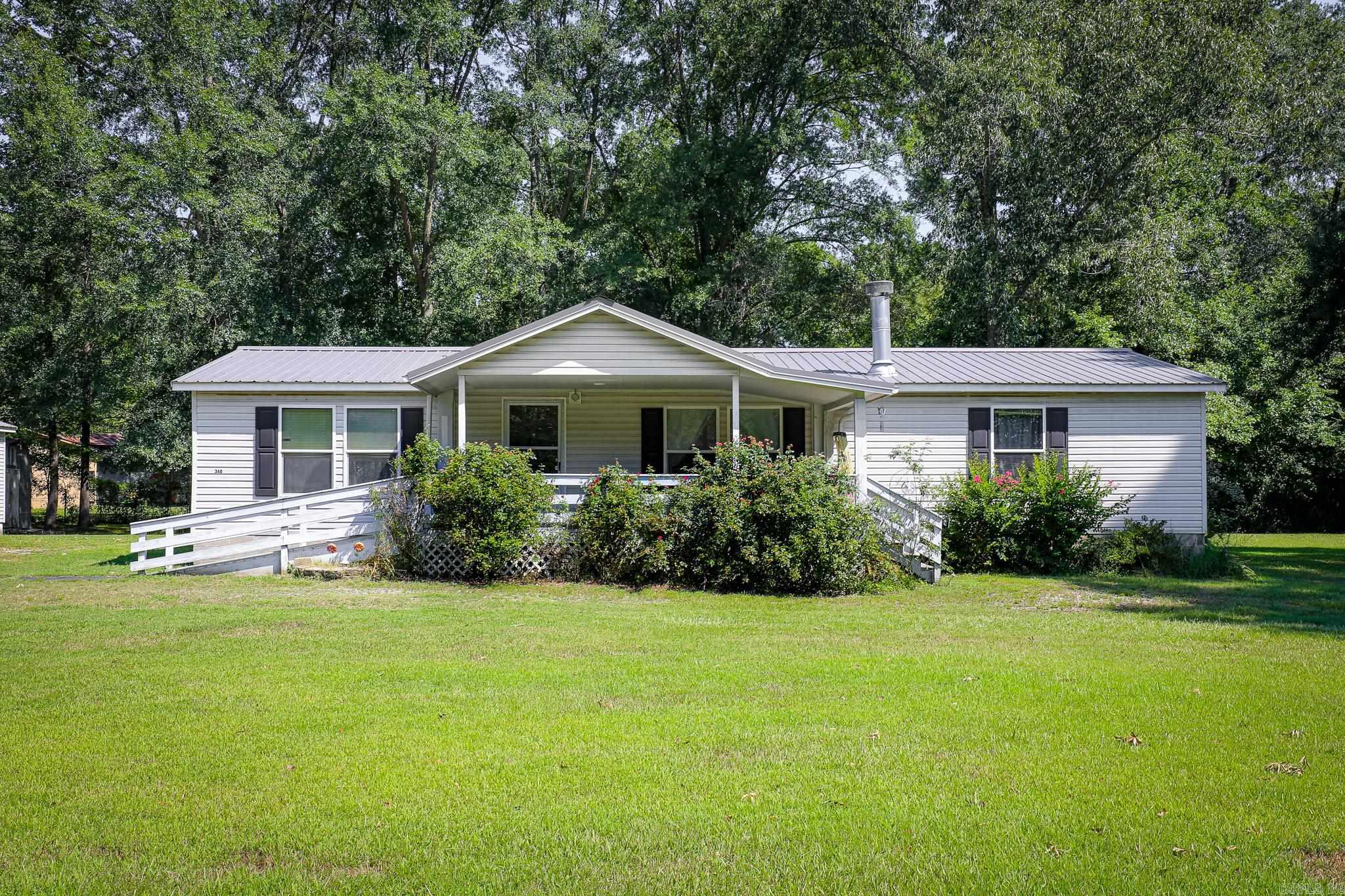 Welcome to your own peaceful oasis!! This 3 bedroom, 2 bathroom home is nestled on a beautiful 2.68 acres, offering both privacy and convenience. The property includes a 50x30 shop, 24x30 shop with a 24x20 covered double carport and a 10x12 shed providing ample workspace and storage options. Located just minutes from local schools and easy access to the interstate. Water Heater was replaced in March of 2025 and new furnace in November of 2024. Washer, Dryer and refrigerator to convey. Don't miss out on this opportunity!! Please see agent remarks!!
