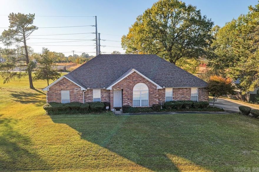 Looking for a peaceful home with space to stretch out but still want to be close to everything in Texarkana? This 4-bedroom, 2-bath brick home sits on just over an acre in the Red Lick School District, offering privacy, comfort, and convenience all in one. Step inside and you’ll love the open kitchen, breakfast area, and large living room with a cozy gas fireplace, perfect for family time or weekend get-togethers. Morning light fills the space, and the split floor plan gives everyone room to relax. The formal dining area is great for holidays, while the large laundry room with a sink and extra storage keeps life organized. The primary suite is a quiet retreat with two walk-in closets, double vanities, a soaking tub, and a walk-in shower. Each bedroom offers generous space and storage, ideal for family or guests. Outside, enjoy your covered patio overlooking a big backyard, great for grilling, pets, or simply watching the sunset. Located on a quiet, dead-end street, this home feels tucked away yet is just minutes from I-30, restaurants, shopping, hospitals, and all that Texarkana offers. Contact today to schedule a private tour.