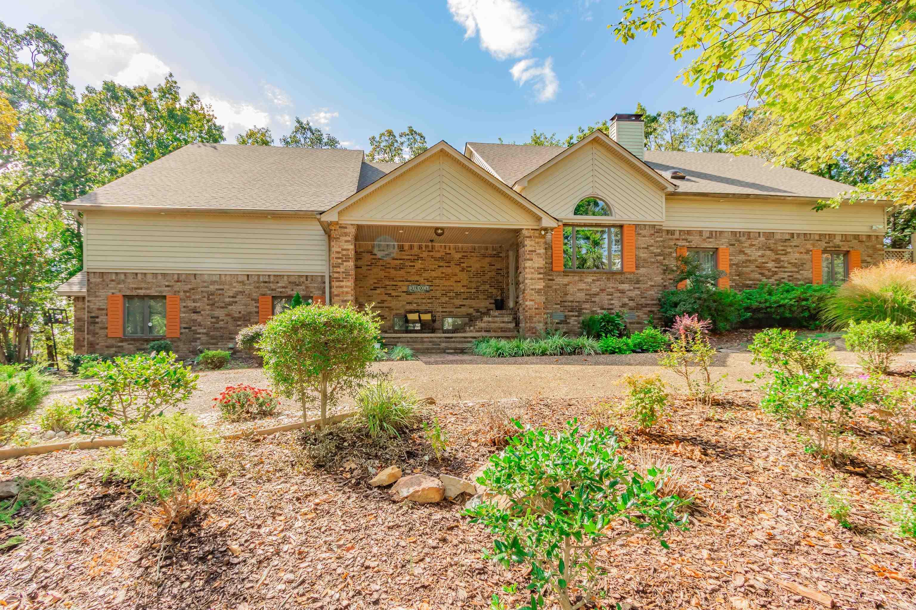 Must-see gem! This stunning 4-bedroom home offers spacious rooms, each with a private en-suite bath and walk-in closet. The luxurious master suite features his & her bathrooms, dual walk-in closets, and a private deck. Enjoy a cozy library, open-concept living with a wall of windows, wood-burning fireplace, and a large formal dining/sitting area. The entertainerās kitchen includes an island, breakfast bar, abundant countertops, built-ins, and a walk-in pantry with sink. A bright breakfast nook overlooks the serene backyard with 14 mature hickory trees. Outdoor living shines with multiple decks, a water fountain, and room to relax or entertain. Additional highlights: 3-car garage, workshop off of garage, and excellent storage throughout. This home blends elegance, comfort, and functionalityāa true must-see!