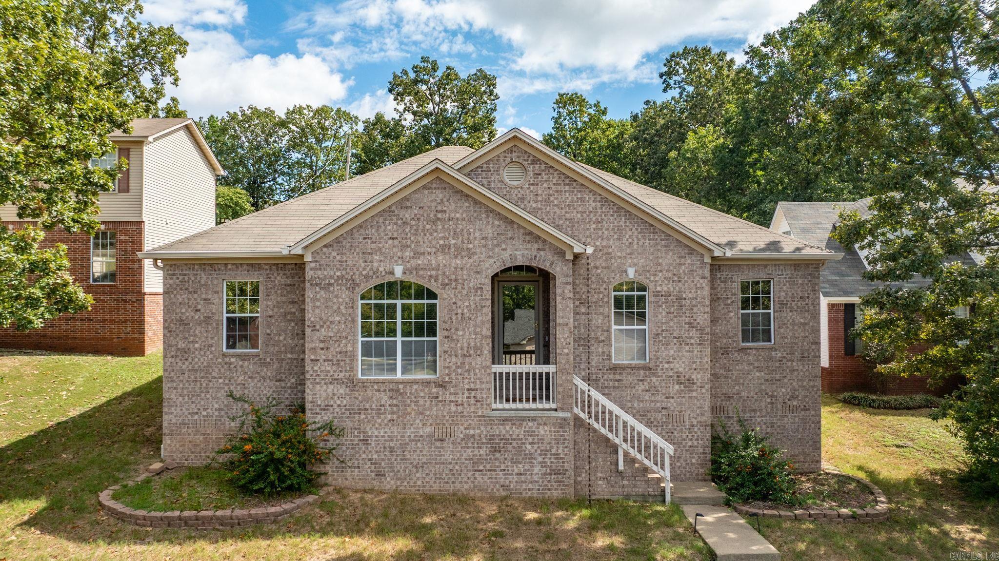 Charming and very well-maintained one-level brick home nestled in the heart of West Little Rock. This thoughtfully designed 3-bedroom, 2-bath home offers a comfortable and functional layout, perfect for both everyday living and entertaining. The spacious living room features a unique wraparound fireplace that flows seamlessly into the kitchen, creating a warm and inviting atmosphere. Stainless steel appliances. Recent updates include a new roof installed in 2017, a new water heater in 2018, and most recently, brand-new gutters—offering peace of mind and enhancing the home’s exterior appeal. The home sits on a manageable 0.20-acre lot with a rear-entry driveway and attached garage, providing both convenience and curb appeal. With its solid brick and siding exterior, classic design, and history of consistent upkeep, this home is truly move-in ready. Located in a quiet, established neighborhood with easy access to shopping, dining, and schools, 1509 Gamble Road offers the perfect balance of comfort, quality, and location. AGENTS SEE REMARKS!