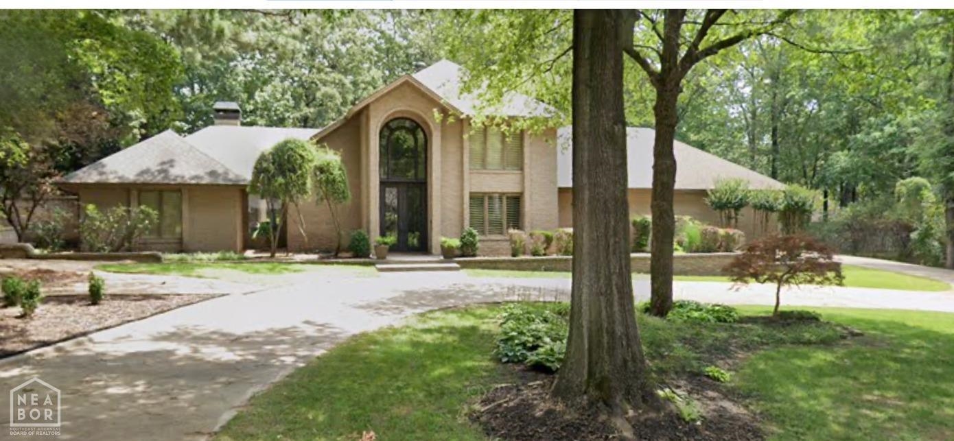 Location! Location! The updated traditional design of this home boasts timeless elegance, and is located in the heart of the town, just minutes away from dozens of restaurants and stores. As you enter this 5500 square foot home, you will be struck by the dramatic front entry with Quantum Entry Iron Doors. The warm and welcoming monochromatic paint color throughout the home, along with the plantation shutters on the windows, create a cozy and inviting atmosphere. This spacious home has 4 bedrooms and 5 bathrooms, with all four bedrooms en suite and featuring walk-in closets. The master and guest ensuite are located on the main floor, while the other two bedrooms and large bonus room are upstairs. The open concept floor plan of this home features soaring ceilings in the living room, allowing for plenty of natural light to fill the space. The tile and carpet flooring provide a clean and polished look, while the large Gilmore Custom Kitchen is equipped with 2 newly replaced dishwashers, Sub zero refrigerator, kitchen aide oven, built in under counter ice-maker, and a new commercial disposal.