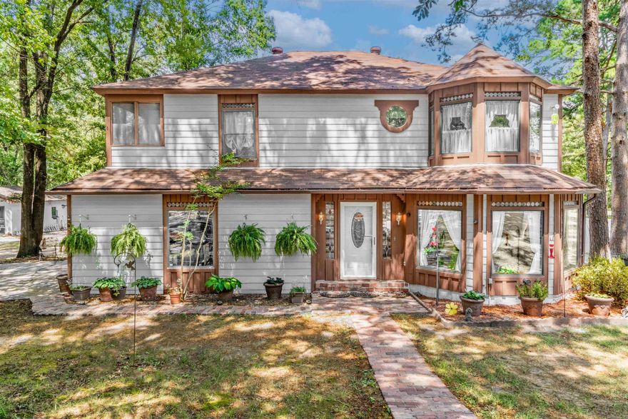 This enchanting Queen Anne–style home sits on 4.91 acres framed by mature trees. The grounds include a year-round pond, fenced pasture with barbless wire and wood fencing, and garden space with rich soil and raised beds—perfect for horses, gardening, and small-scale farming. The spacious 2,663 sq ft layout features 8-foot ceilings, generous storage throughout, and insulated Pella windows that fill the home with natural light. Recent updates include a new roof, quartz kitchen countertops, granite in the primary bath, new carpet, new LVT and tile flooring, and an updated walk-in shower. Additional features include an attached two-car garage, a detached 24x30 garage/shop, and a beautiful in-ground pool (new liner, pump, & filter 2023). The home also offers a large screened-in porch and a screened walk-out balcony off the bedroom. Located in the Conway School District, this property offers a peaceful setting with space to enjoy both home and land.