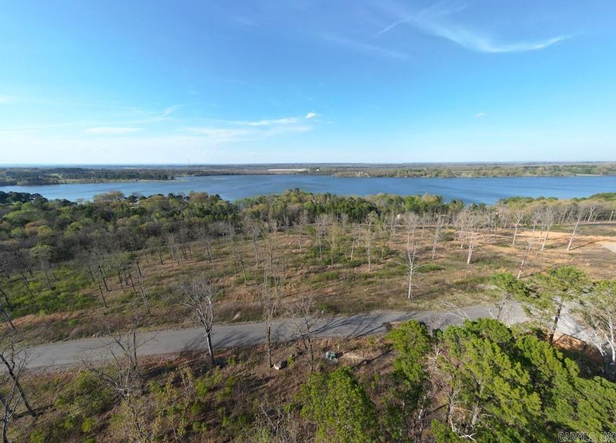 Build your dream home atop the world right in Conway, Arkansas. A view like this is a rare find in the city limits. You simply must drive by to experience it. The view of Beaverfork lake as you top the hill on Waterview Drive is breathtaking. This is one of the largest lots in North View Estates with a stunning lake view.  A hidden gem of real estate.