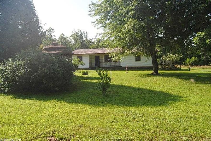 3 Bedroom , 2 bath single family home (1725 ' )  sitting on a little over half acres of land, has a large  two car garage ,nice large  work shop, Has a propane generator that will come on it the power goes off, a nice wood burning fireplace , Has a beautiful gazebo in the front yard to relax and enjoy nature, home has hardwood floors and carpet in bedrooms, has a deck / patio off of master bedroom, central heating and cooling, vinyl siding, and has a metal roof,  PRICED TO SELL.