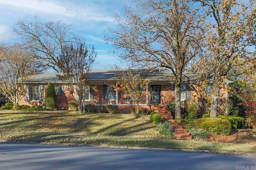 Handsome one level with side loading garage. Spacious living and dining rooms. Cozy den with wood burning fireplace. Well appointed kitchen. Nice usable laundry room. One bedroom with bath opposite end of home than the other three bedrooms. Wider than normal hallways, crown molding, hardwood floors. Private rear yard. Draperies and bookshelves in nursery EXCLUDED.