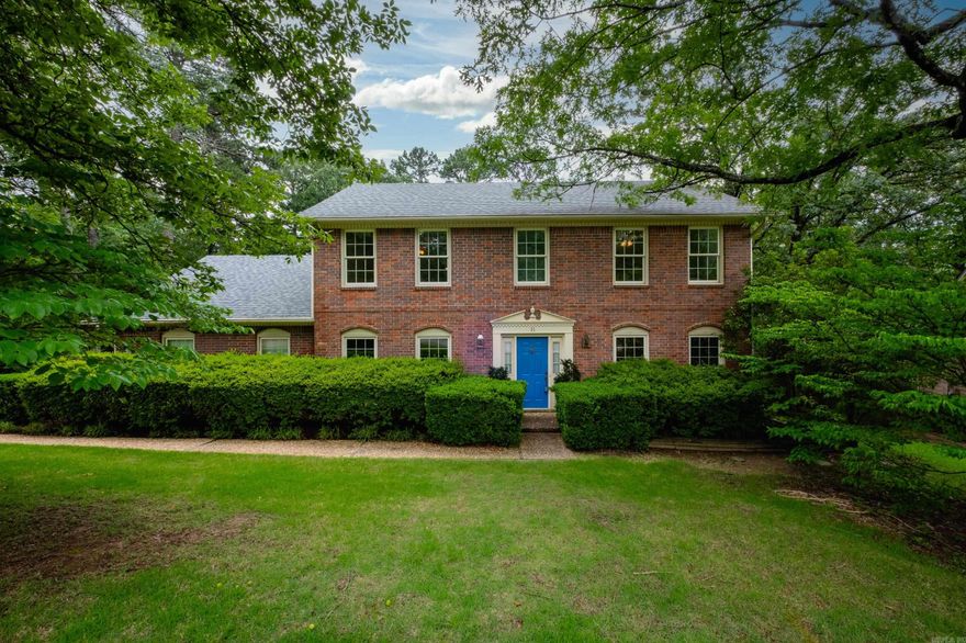 Spacious two story brick traditional on a large, beautifully landscaped lot with mature trees. The main level features a large primary suite with fireplace, formal dining room, living room that flows into the family room, or can be closed off with pocket doors, plus built-ins, a second fireplace, and a wet bar. Light and airy eat-in kitchen includes abundant cabinetry, parquet wood floors, double ovens, cooktop, microwave, and dishwasher. Laundry area and half bath also on main level. Upstairs offers a guest suite, two additional bedrooms, and a full hall bath. Enjoy the fully fenced backyard with lush landscaping, stone pavers, storage shed, and a deck perfect for relaxing or entertaining. Two-car side-load garage with storage closet. Roof replaced in 2018. A lovely home with excellent space inside and out, ready for you to make your own. Come see!
