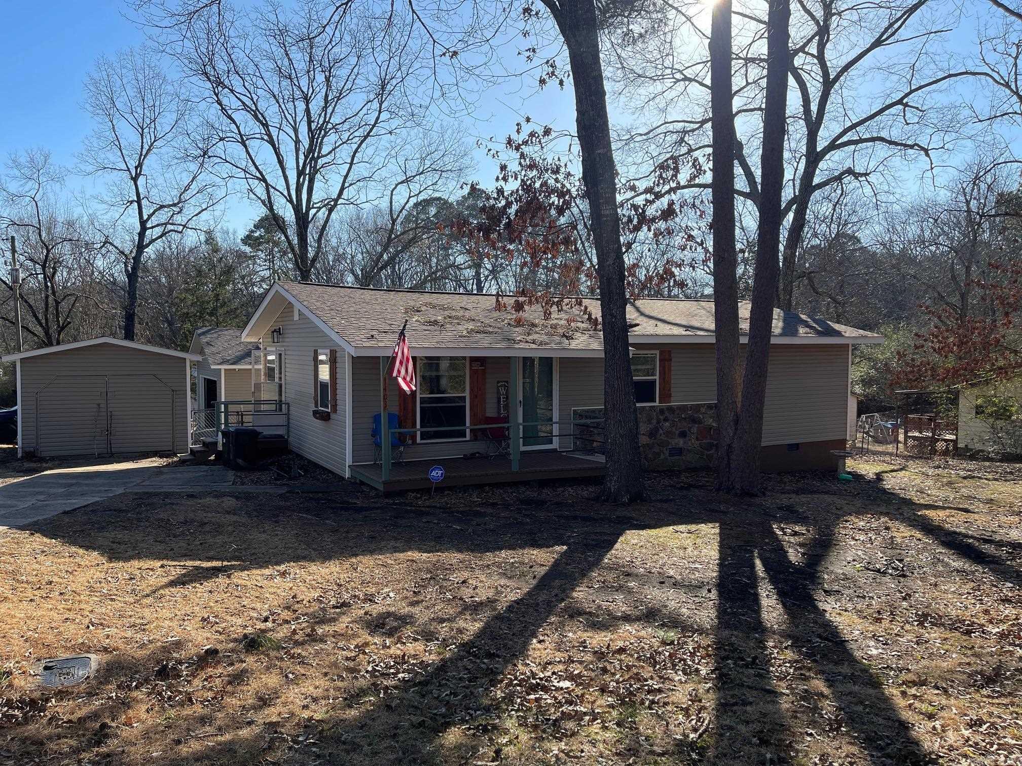 Remodeled home in the heart of Heber Springs on a corner lot with a fenced-in back yard. The 20x30 detached shop has electric, a roll-up door, and a walkthrough door. This property also has a 16x19 shed with electric. If you're looking for a starter home or investment property, or looking to downsize, this is a great property with some of the updates already completed. See Agent Remarks.
