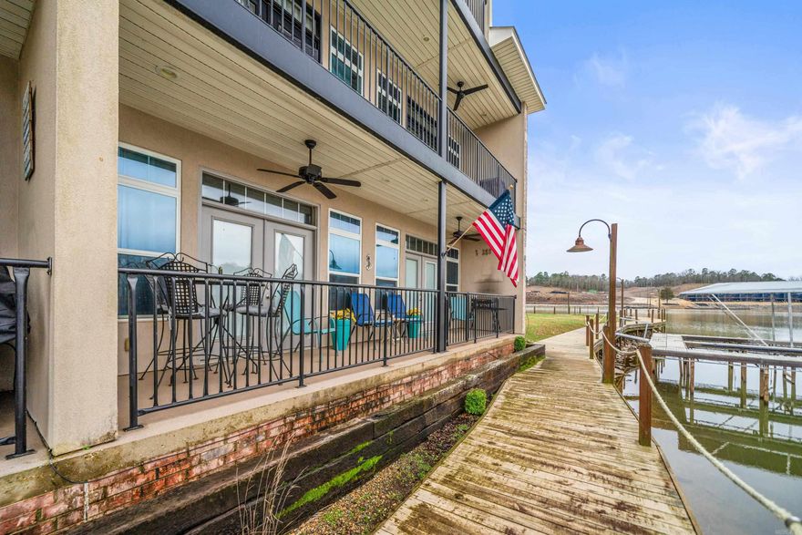 This beautiful end-unit condo offers breathtaking lake views and is fully furnished for your convenience. With a boat slip just outside your back door, enjoy easy access to the water. The condo includes an enclosed garage, and being a walk-in level unit, it provides added comfort and accessibility. Located in a desirable area that allows nightly rentals, this property offers both relaxation and investment potential. Don't miss out on this rare opportunity to own a piece of lakeside paradise!